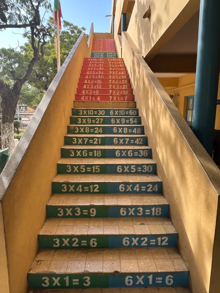 A school staircase with multiplication tables painted across each step